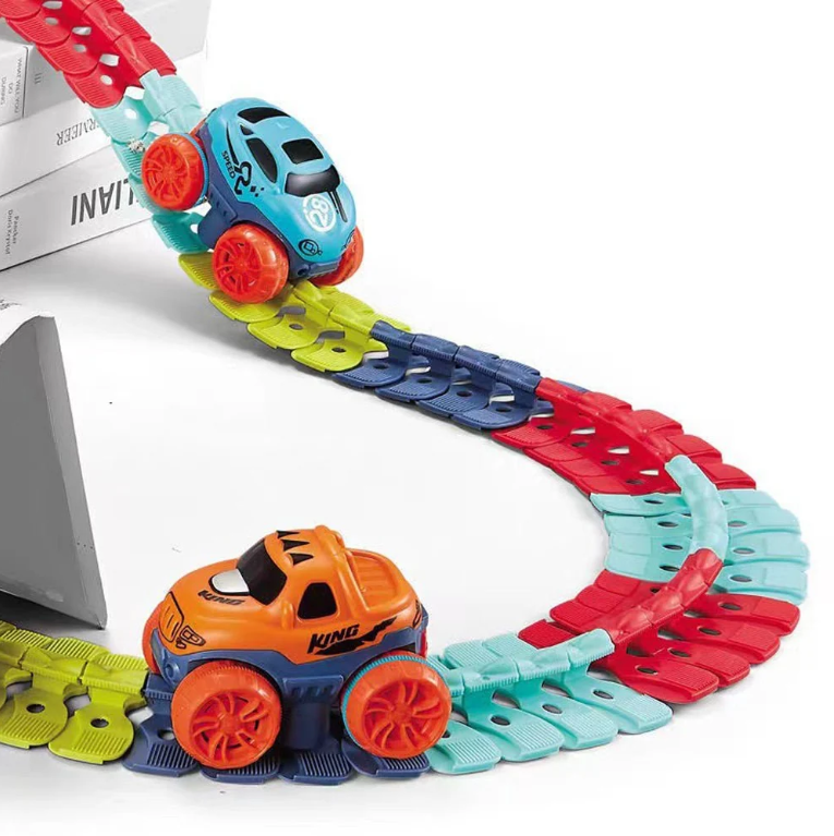 Two race cars — blue SR Speed and orange King — racing on assembled colorful flexible track with elevated ramp