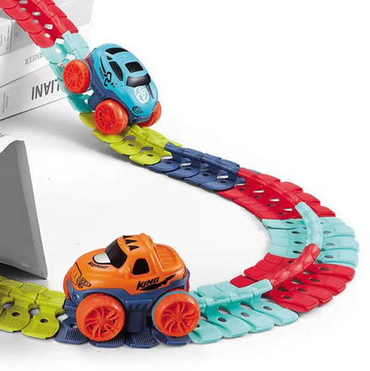 Two race cars — blue SR Speed and orange King — racing on assembled colorful flexible track with elevated ramp